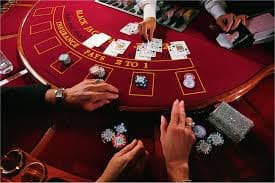 Live deal in progress Live croupier dealing Infinite Blackjack cards from shoe on paten77 login